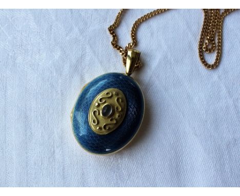 An 18ct gold and blue guilloche enamel and cabochon locket of oval form on a 9ct yellow gold necklace
