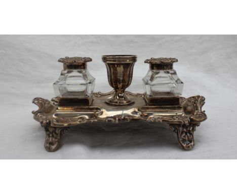 A late Victorian silver desk standish, with a central urn and two glass and silver topped inkwells, Sheffield,1867, Henry Wil