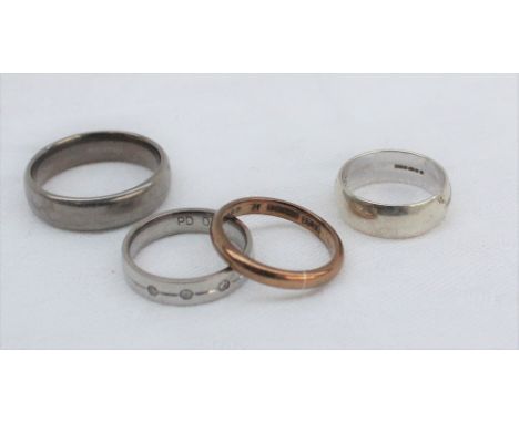 Two 9ct gold wedding bands, approximately 6.5 grams together with a titanium wedding band and a diamond set wedding band