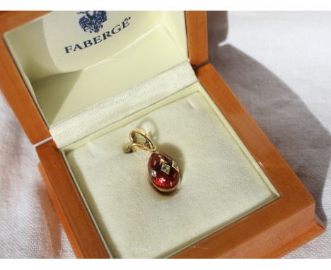 Victor Mayer for Faberge an 18ct gold, diamond and red enamel egg shaped pendant, set with three diamonds totally o.o6 of a c