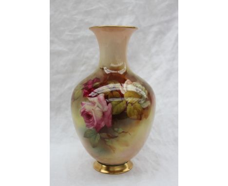 A Royal Worcester porcelain baluster vase painted with roses and leaves to a blush ivory ground, signed R Austin, puce mark, 