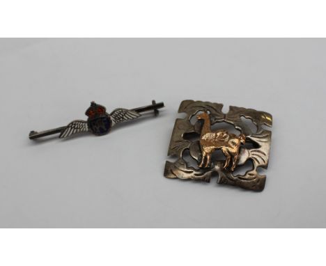 A yellow and white metal pierced brooch applied with a Llama marked 18ct and silver together with an RAF enamel sweetheart br