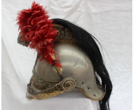 A French 19th Century Cuirassier’s Helmet in white and yellow metal, with a gilt metal comb, to each side floral leaf decorat