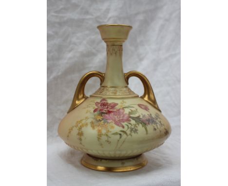 A Royal Worcester porcelain twin handled single stem vase, decorated with a spray of garden flowers on a spreading foot, puce