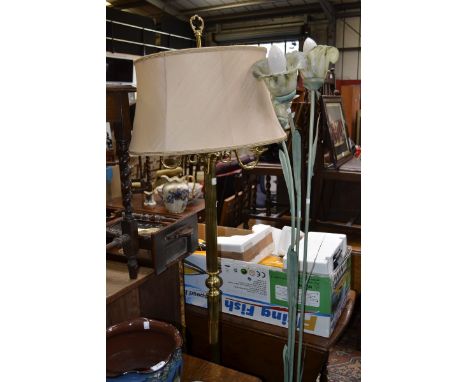 A three light metal standard lamp; a brass effect four light standard lamp 