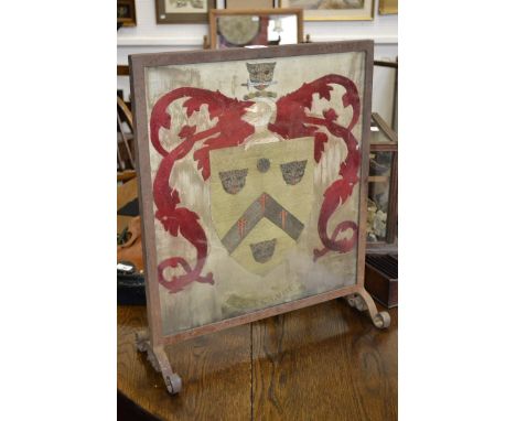 An 18th century silk work armorial panel, 49.5cm x 44cm, later mounted as a firescreen

The shield bears the arms of Snassell