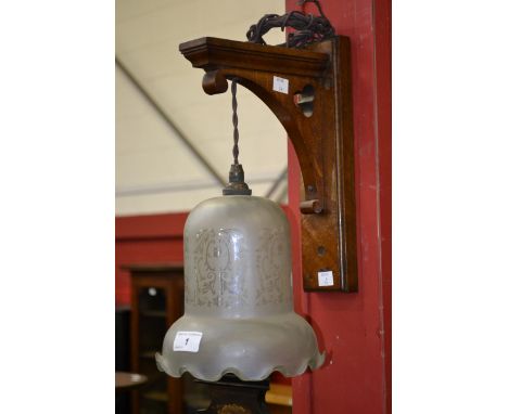 Gothic revival oak wall lamp with etched glass shade