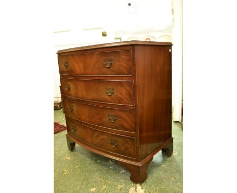 An 18th century style mahogany bow fronted chest of four long drawers, bracket feet, maker's label to verso