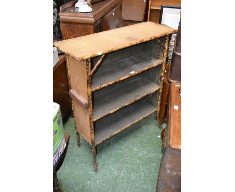 A bamboo three shelf bookcase 