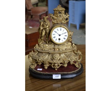 A 19th century French gilt mantel clock with base