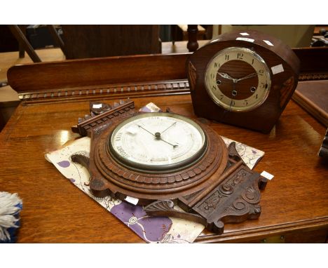 An oak barometer; an oak mantel clock with key (2)