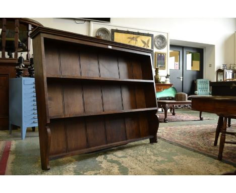 An oak three shelf wall mounted plate rack