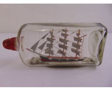 A model of a sailing ship in a bottle, circa 1944, sails made from a WWII barrage balloon