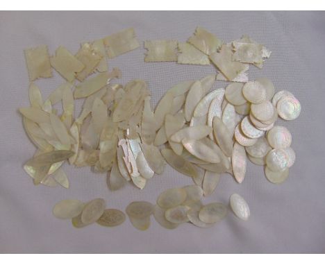 A quantity of oriental Mother of Pearl counters of various shape and form