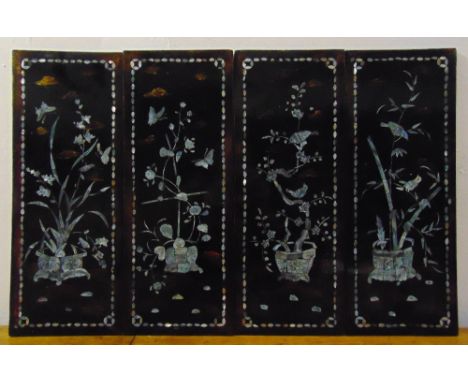 Four oriental lacquered wall panels inset with Mother of Pearl birds and flowers