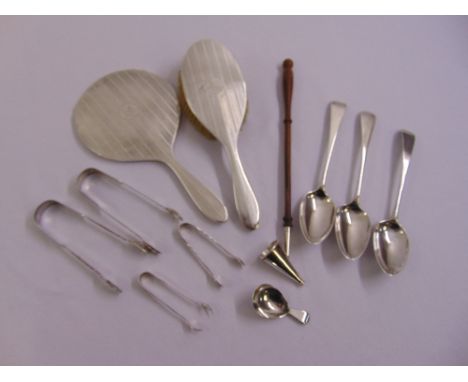 A quantity of silver to include four pairs of silver sugar tongs, three dessert spoons, a caddy spoon, a matching hand mirror