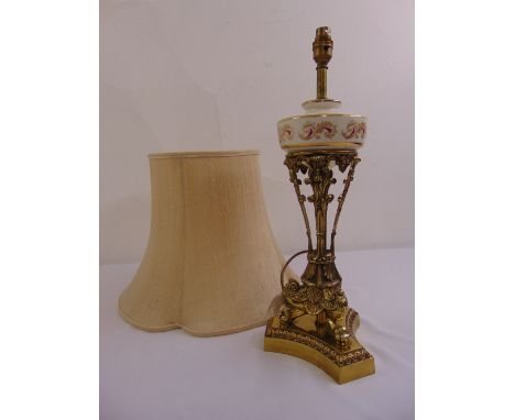 A gilt metal and porcelain table lamp on triform base with silk shade