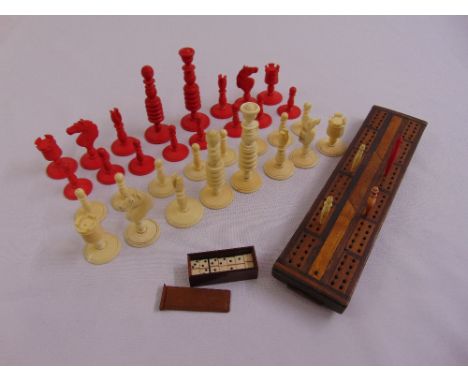 A composition chess set, a set of miniature dominoes and a cribbage board with counters