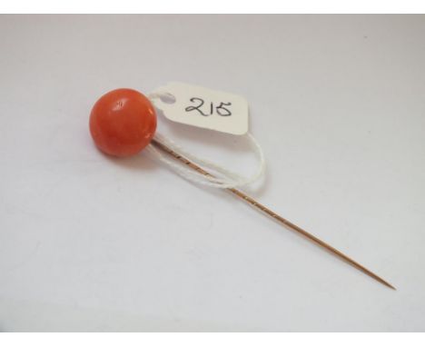 Gold mounted coral button shaped stick pin    