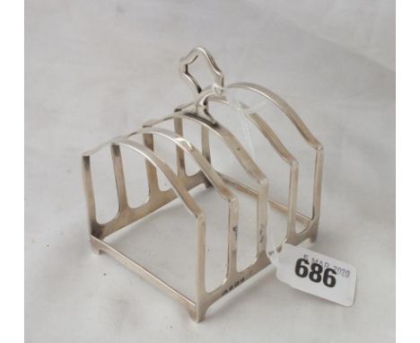 Four division toast rack on bracket feet, 2.75” long B’ham 1927 by A Bros 80g.        