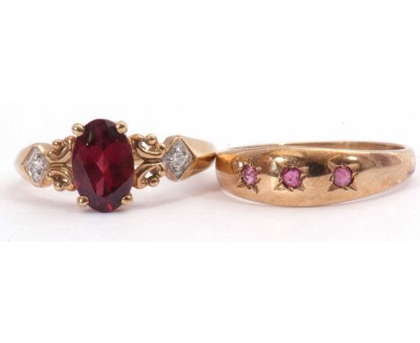 Mixed Lot: 9ct gold garnet and small diamond ring, the oval faceted garnet between scroll decorated shoulders, each highlight