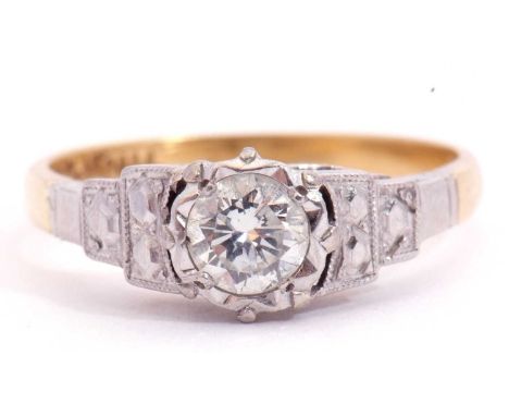 Single stone diamond ring, the round brilliant cut diamond, 0.25ct approx, raised above descending box shoulders, stamped 18c