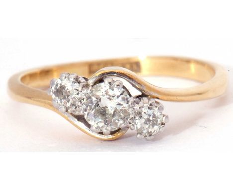 Three-stone diamond cross over ring featuring three graduated old cut diamonds, total ct wt approx 0.30, stamped 18ct and Pla
