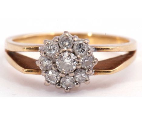 Diamond cluster ring, a flowerhead design, featuring nine round brilliant cut diamonds, 0.50ct approx, raised above split ang