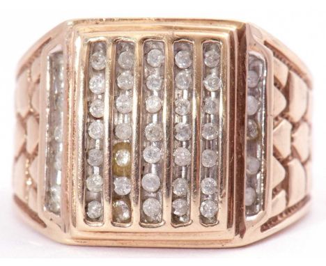 375 stamped large dress ring, the rectangular panel multi set with cubic zirconia stones, raised between patterned textured s