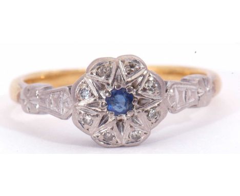 Sapphire and diamond set cluster ring, the centre round sapphire surrounded by small single cut diamonds, all in illusion set