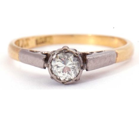 Single stone diamond ring featuring a round brilliant cut diamond, 0.20ct approx, raised between upswept shoulders and stampe