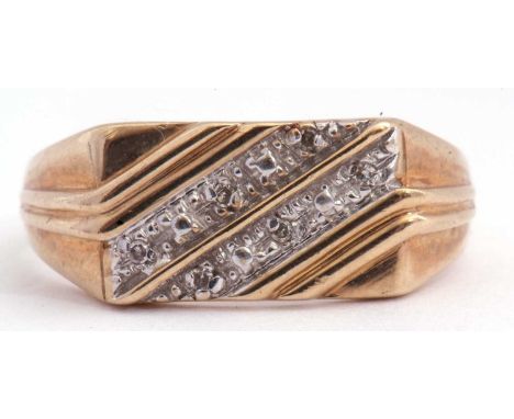 Gents 9ct gold and diamond set ring, the panel a rectangular angular shaped design decorated with two diagonal rows of small 