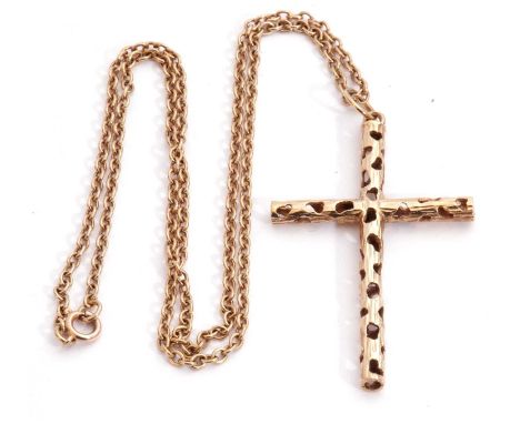 9ct gold cross pendant, a hollow pierced textured design, 5 x 3cm, London 1979, suspended from a yellow metal chain, g/w 9.6g