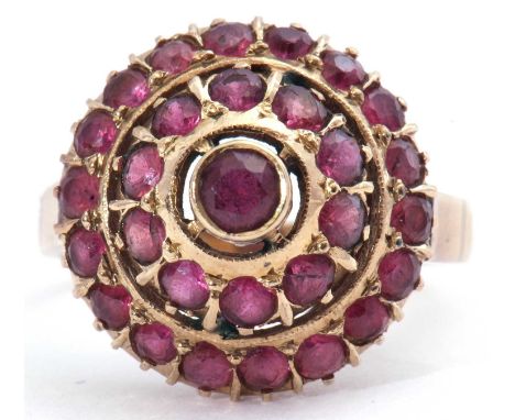 Modern dome shaped ruby cluster ring, a three tier design, to a plain shank, stamped 18K, size P