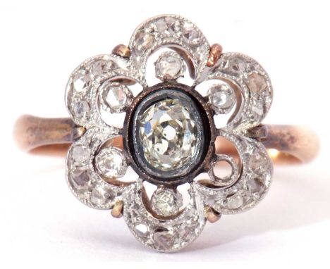 Antique diamond cluster ring, the centre old cut diamond bezel set in an open work design, further set with small old cut sto