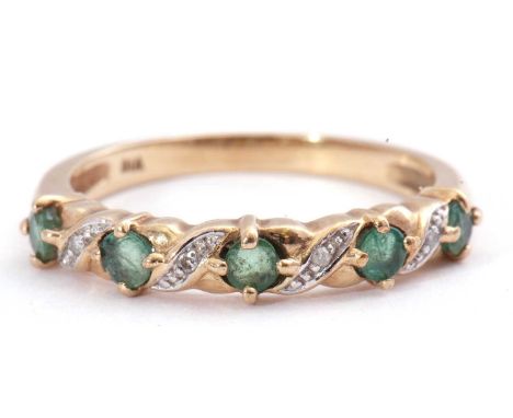 Modern diamond and emerald half eternity ring, alternate set with five round faceted small emeralds, between single cut small