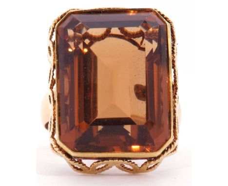 Large cognac citrine dress ring of rectangular shape in a filigree style mount to a plain polished shank (tested 18ct), size 