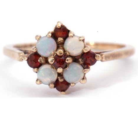 9ct gold opal and garnet cluster ring featuring four small opals and five small garnets in a flowerhead design, size K