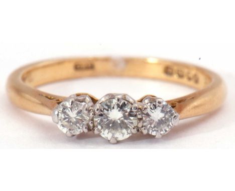 Three stone diamond ring featuring three small graduated round brilliant cut diamonds, 0.25ct total approx, in coronet settin