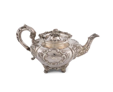 A VICTORIAN IRISH SILVER TEAPOT, Dublin 1849, mark of Robert W Smith, of squashed melon form, the domed hinged lid with natur