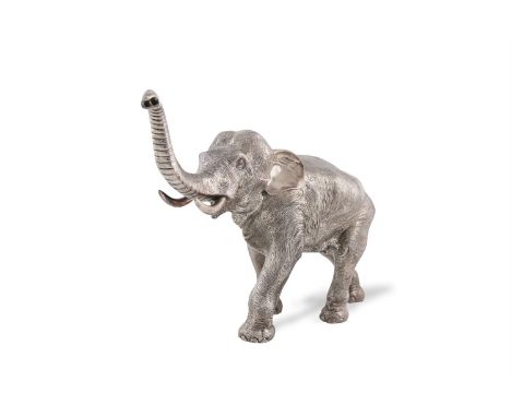 AN IMPRESSIVE SILVER MODEL OF A MARCHING ELEPHANT WITH TRUNK HELD ALOFT, Sheffield 2015, mark of Carr's of Sheffield Ltd, wei