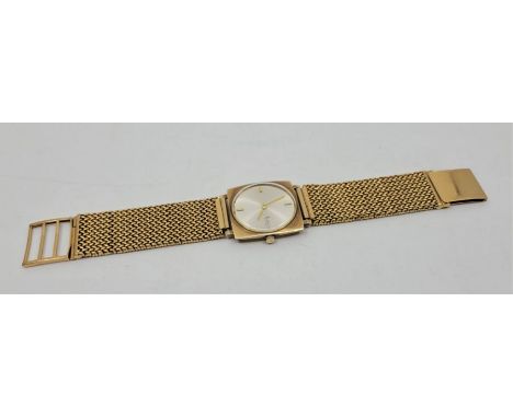 An Accurist 14ct. gold gentleman's bracelet watch, manual movement, having 28mm wide cushion case, signed circular dial, Accu