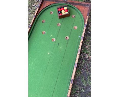 A 19th cent bar billiards board complete with original ivory balls