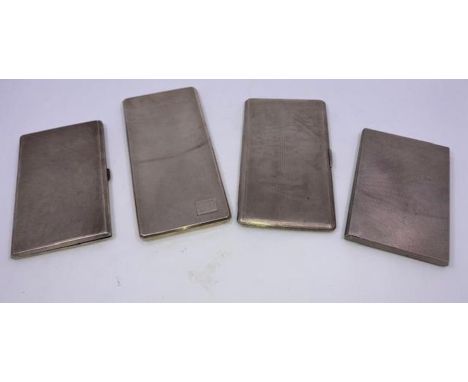 A large silver cigarette case engine turned inside gilt and inscribed Chester 1934 and three other large silver cigarette cas