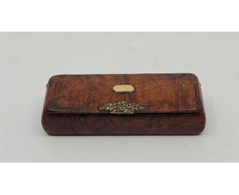 A 19th century precious yellow metal mounted burr wood snuff box, length 6.9cm.&nbsp;
