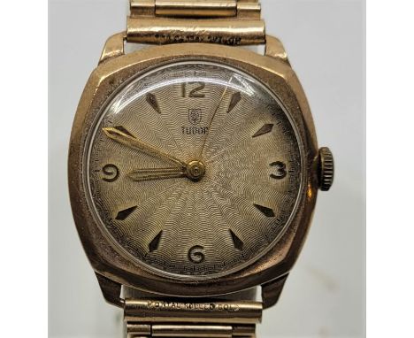 A Tudor 9ct. gold gentleman's wrist watch, c.1954, manual movement, having 29mm wide 9ct. gold cushion case with signed circu