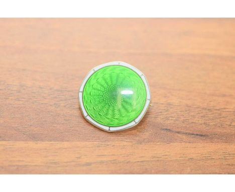 An art deco Scandinavian silver and enamelled brooch, green guilloche enamel with white border, 2.7cm diameter