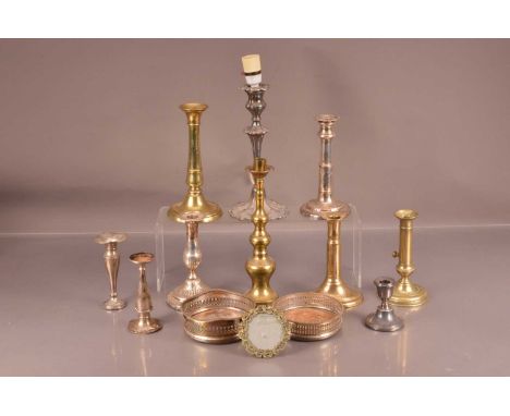 A group of candlesticks and other items, including a pair of silver filled trumpet vases, two wine bottle coasters and more