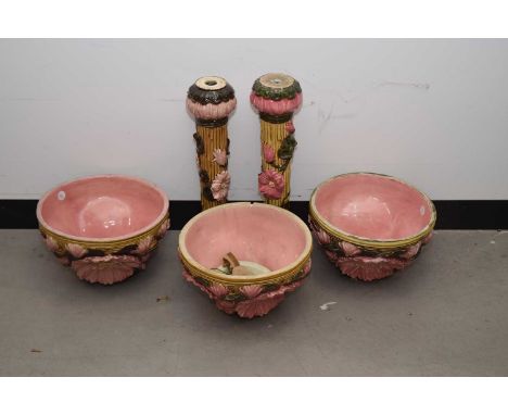 Eight pieces of early 20th century Zsolnay pottery jardinieres on stands or ornamental water fountain parts, with what appear