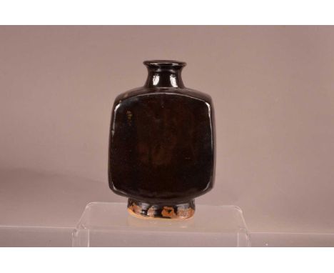 Bernard Leach (1887-1979), a stoneware rectangular bottle vase in tenmoku glaze, with impressed BL and St Ives marks to base.